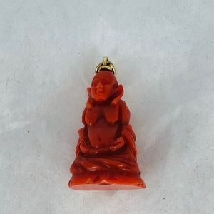 Vintage hand carved coral Buddha charm